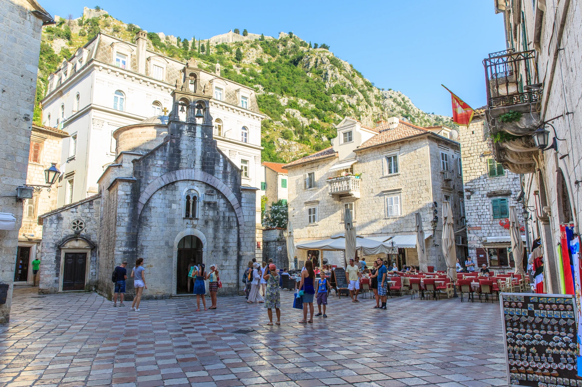 Historic View of Kotor Cathedral Framed by Stone Archways